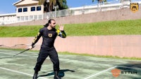 a man holding a tennis racket on a tennis court